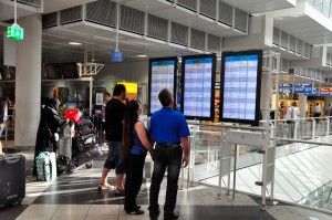 Passengers checking flight schedules in Munich