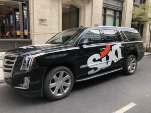 A Sixt Cadillac in front of Cadillac House in SoHo